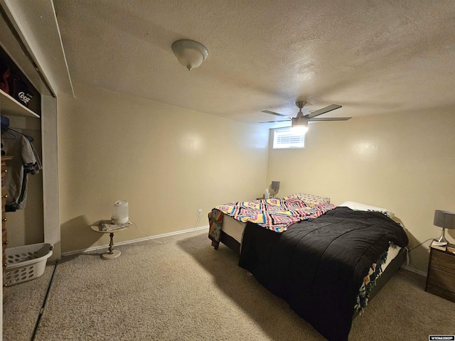 bedroom featuring carpet flooring, a textured ceiling, ceiling fan, and baseboards