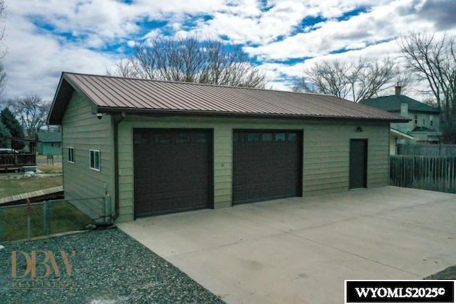 detached garage with fence