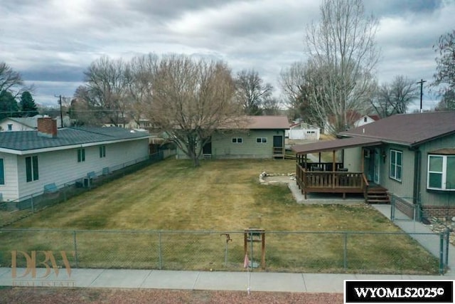exterior space featuring a deck and a fenced backyard
