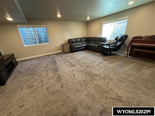 109 Chardonnay, Rock Springs, WY 82901 - living area featuring baseboards, carpet flooring, and recessed lighting