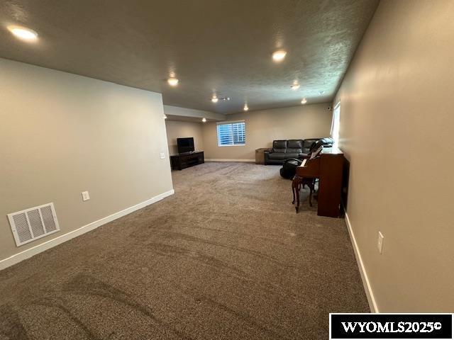 109 Chardonnay, Rock Springs, WY 82901 - living room featuring recessed lighting, baseboards, visible vents, and carpet