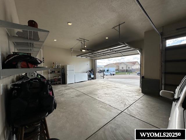 109 Chardonnay, Rock Springs, WY 82901 - garage featuring freestanding refrigerator