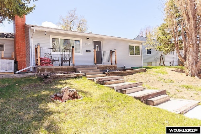 single story home with central AC, a chimney, and a front lawn