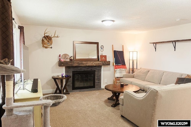 carpeted living room with a brick fireplace and a textured ceiling