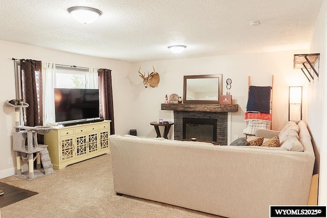 carpeted living room with a textured ceiling and a brick fireplace