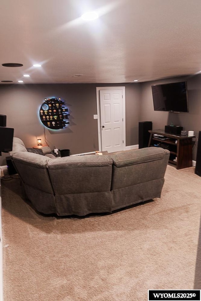 living room with carpet floors and recessed lighting