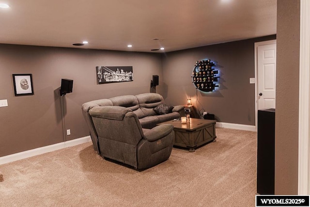 home theater room with baseboards, light carpet, and recessed lighting