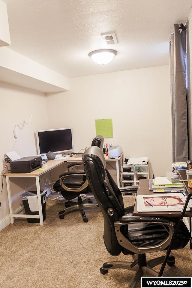 home office featuring carpet floors and visible vents