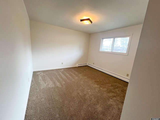unfurnished room featuring dark colored carpet, baseboards, and a baseboard radiator