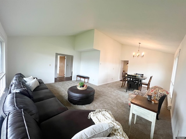 living area with baseboards, carpet flooring, a chandelier, and lofted ceiling