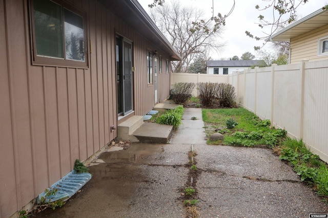 view of yard with a fenced backyard, a patio area, and entry steps