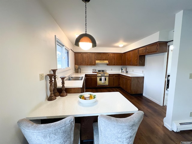 kitchen with white range with gas stovetop, dark wood-type flooring, light countertops, under cabinet range hood, and a sink