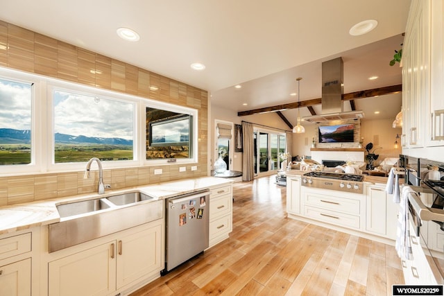 88 Turnberry Dr, Sheridan, WY 82801 - kitchen featuring appliances with stainless steel finishes, a sink, light stone counters, open floor plan, and vaulted ceiling with beams