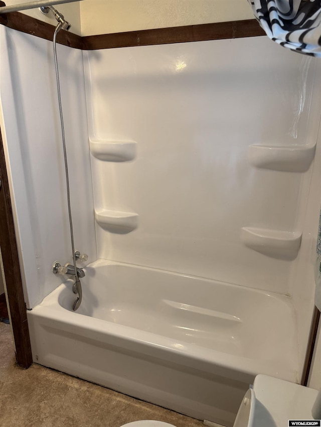 124 Railroad St, Lingle, WY 82223 - bathroom featuring washtub / shower combination
