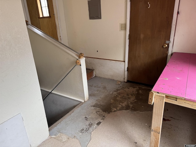 124 Railroad St, Lingle, WY 82223 - stairway featuring concrete flooring and electric panel