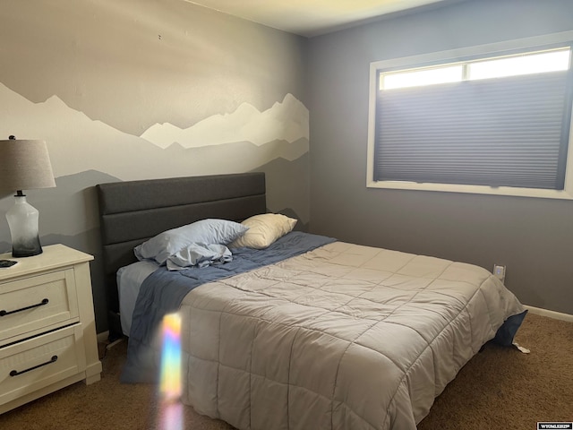 bedroom featuring baseboards and carpet flooring
