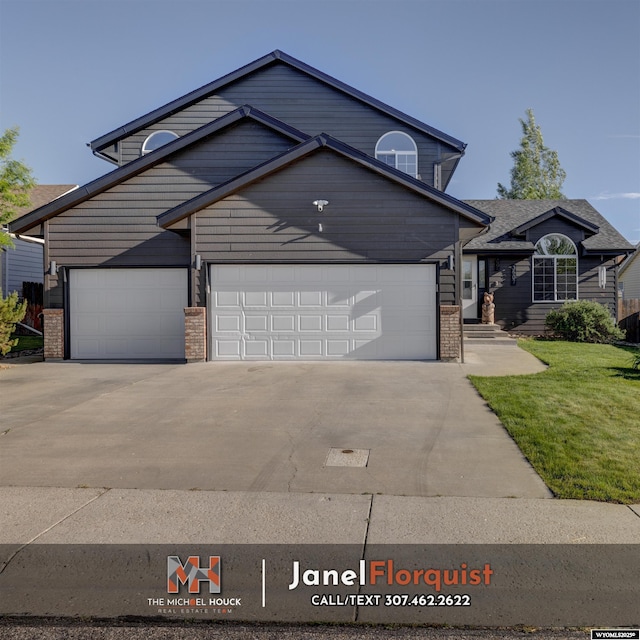 3507 Aspen Ln, Casper, WY 82604 - traditional-style house featuring brick siding, a garage, a front lawn, and driveway
