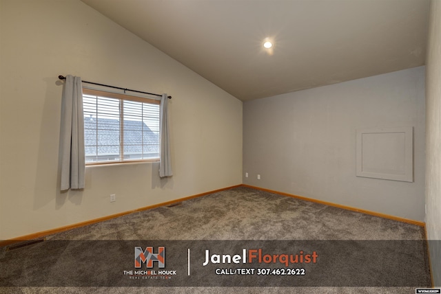 carpeted empty room featuring baseboards, visible vents, and lofted ceiling