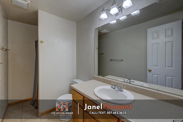 bathroom with vanity, tile patterned flooring, toilet, and visible vents
