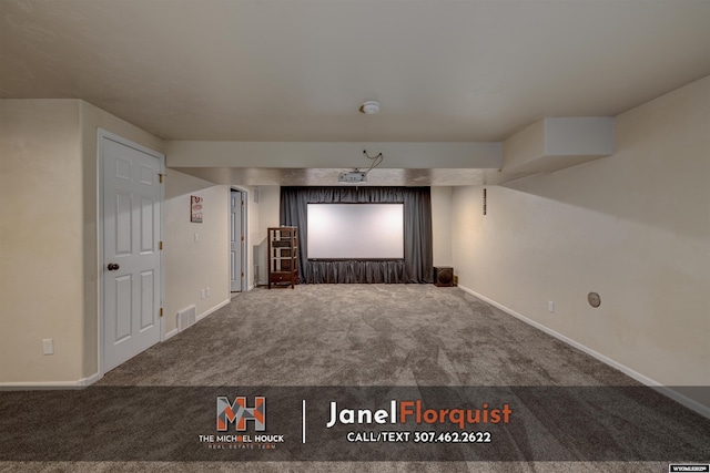cinema room with baseboards, carpet flooring, and visible vents