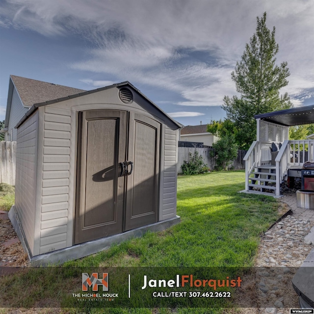 view of shed with fence