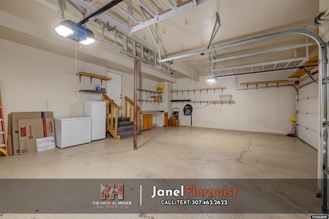 garage with a garage door opener, white fridge, and refrigerator