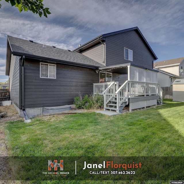 3507 Aspen Ln, Casper, WY 82604 - back of house with a lawn, a wooden deck, and a shingled roof