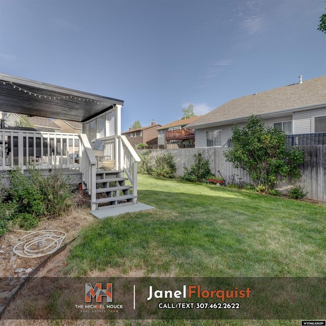 3507 Aspen Ln, Casper, WY 82604 - view of yard with stairway, fence, and a wooden deck