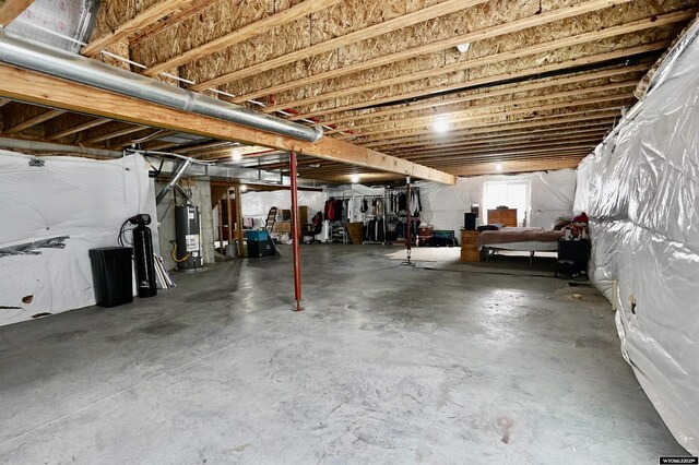 basement featuring water heater