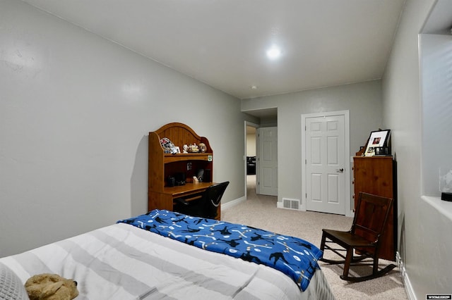bedroom featuring light colored carpet, baseboards, and visible vents