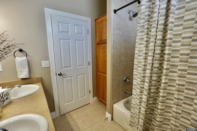 full bath featuring a sink, tile patterned flooring, and shower / tub combo with curtain