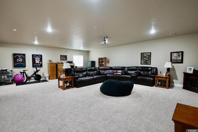 carpeted living room with baseboards and visible vents