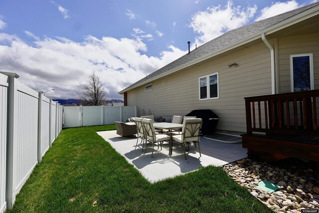 view of yard featuring a patio and a fenced backyard