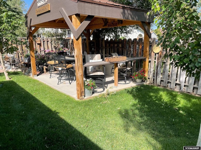 view of patio / terrace with a fenced backyard and a gazebo