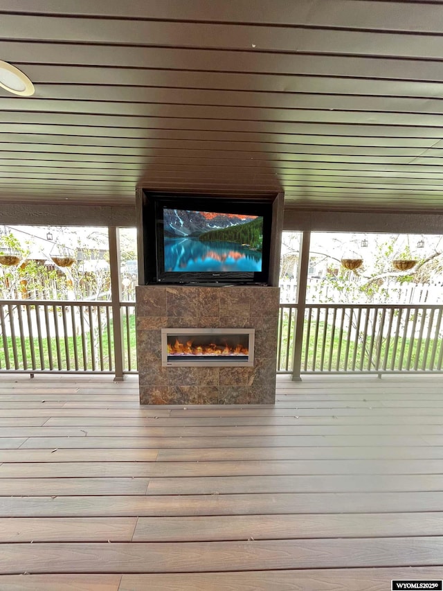 wooden deck with a fireplace
