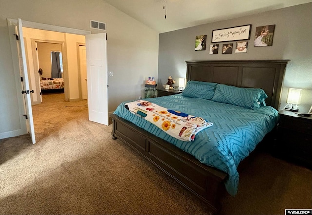 999 Eagle Dr, Douglas, WY 82633 - bedroom with light carpet and lofted ceiling
