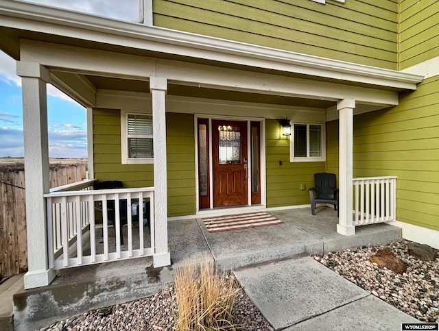 999 Eagle Dr, Douglas, WY 82633 - property entrance featuring a porch and fence