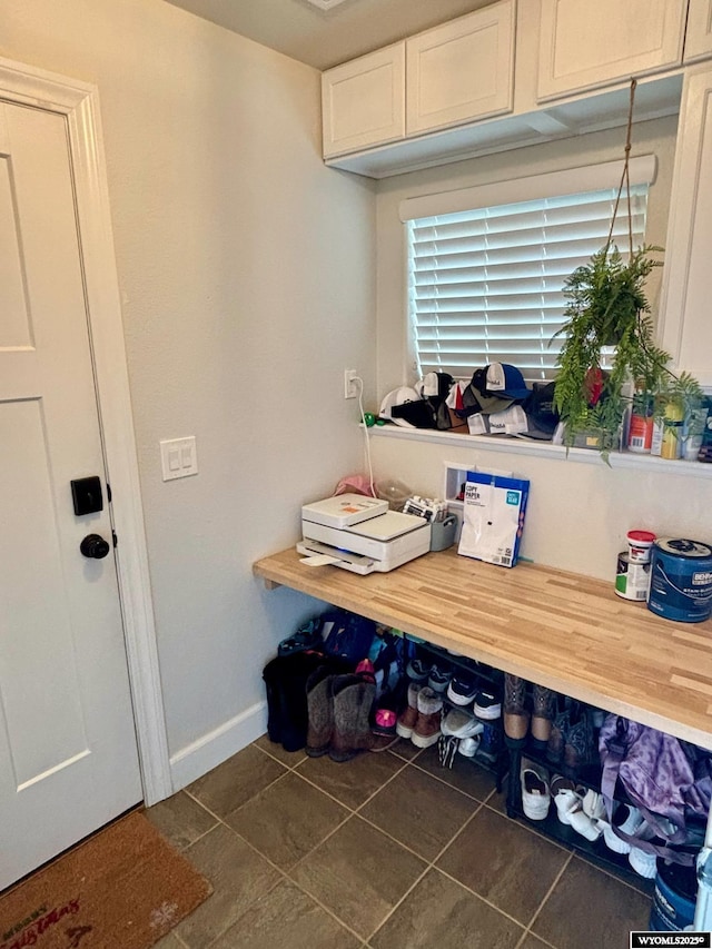999 Eagle Dr, Douglas, WY 82633 - tiled dining space featuring baseboards