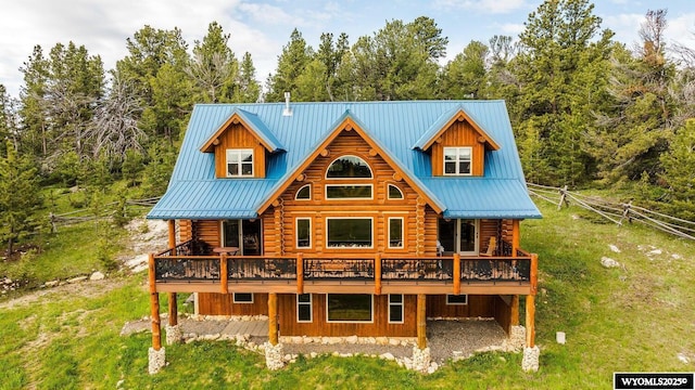 18 High Meadows Rd, Buffalo, WY 82834 - rear view of house with a yard, a deck, and log siding