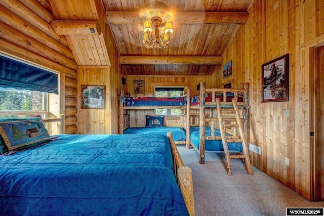 18 High Meadows Rd, Buffalo, WY 82834 - carpeted bedroom with wood ceiling, wood walls, beam ceiling, and a chandelier