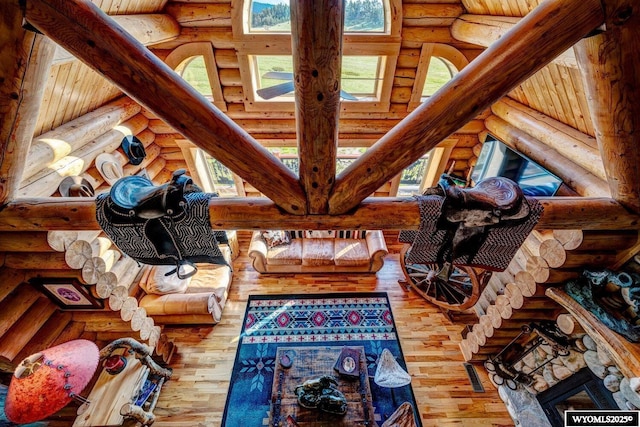 18 High Meadows Rd, Buffalo, WY 82834 - living area featuring log walls and hardwood / wood-style floors