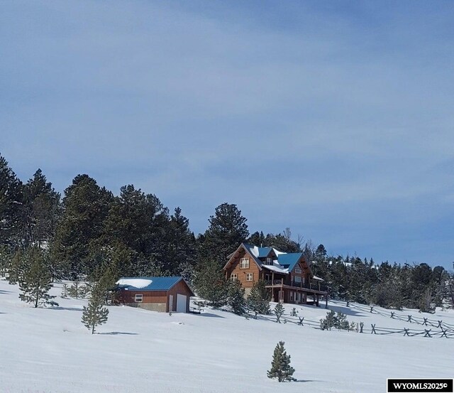 18 High Meadows Rd, Buffalo, WY 82834 - yard covered in snow featuring a garage