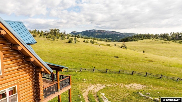 18 High Meadows Rd, Buffalo, WY 82834 - view of yard featuring a deck with mountain view, a rural view, and fence