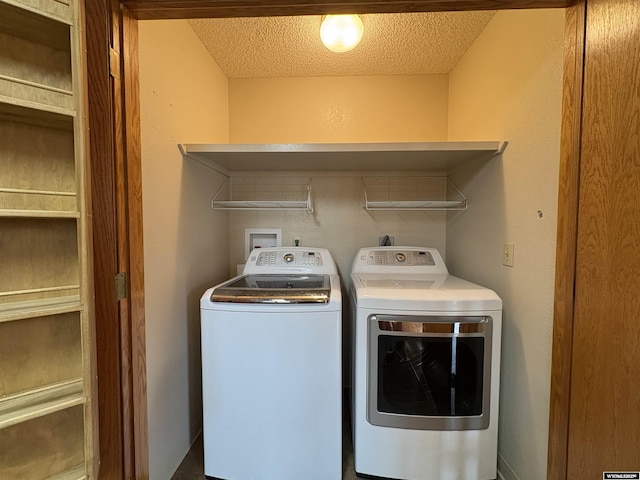 2327 Crestview Dr, Torrington, WY 82240 - washroom with laundry area, a textured ceiling, and washing machine and dryer