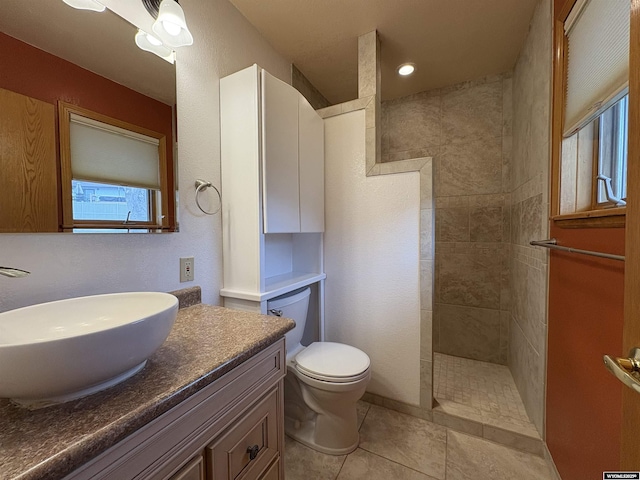 2327 Crestview Dr, Torrington, WY 82240 - bathroom with a walk in shower, vanity, tile patterned floors, and toilet