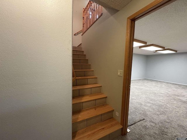 2327 Crestview Dr, Torrington, WY 82240 - stairs featuring baseboards, carpet flooring, and a textured ceiling