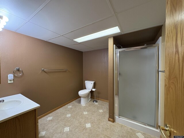 2327 Crestview Dr, Torrington, WY 82240 - full bathroom with vanity, toilet, tile patterned floors, baseboards, and a stall shower