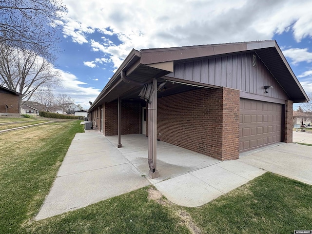 2327 Crestview Dr, Torrington, WY 82240 - view of side of property featuring brick siding, central AC unit, and a lawn