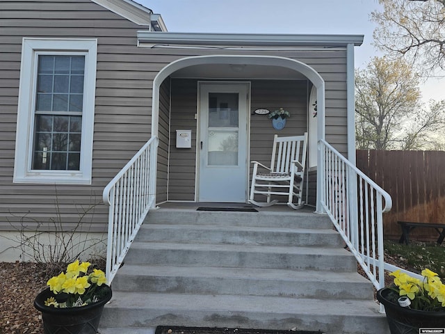 doorway to property with fence