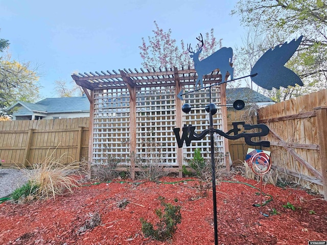 view of side of home featuring fence